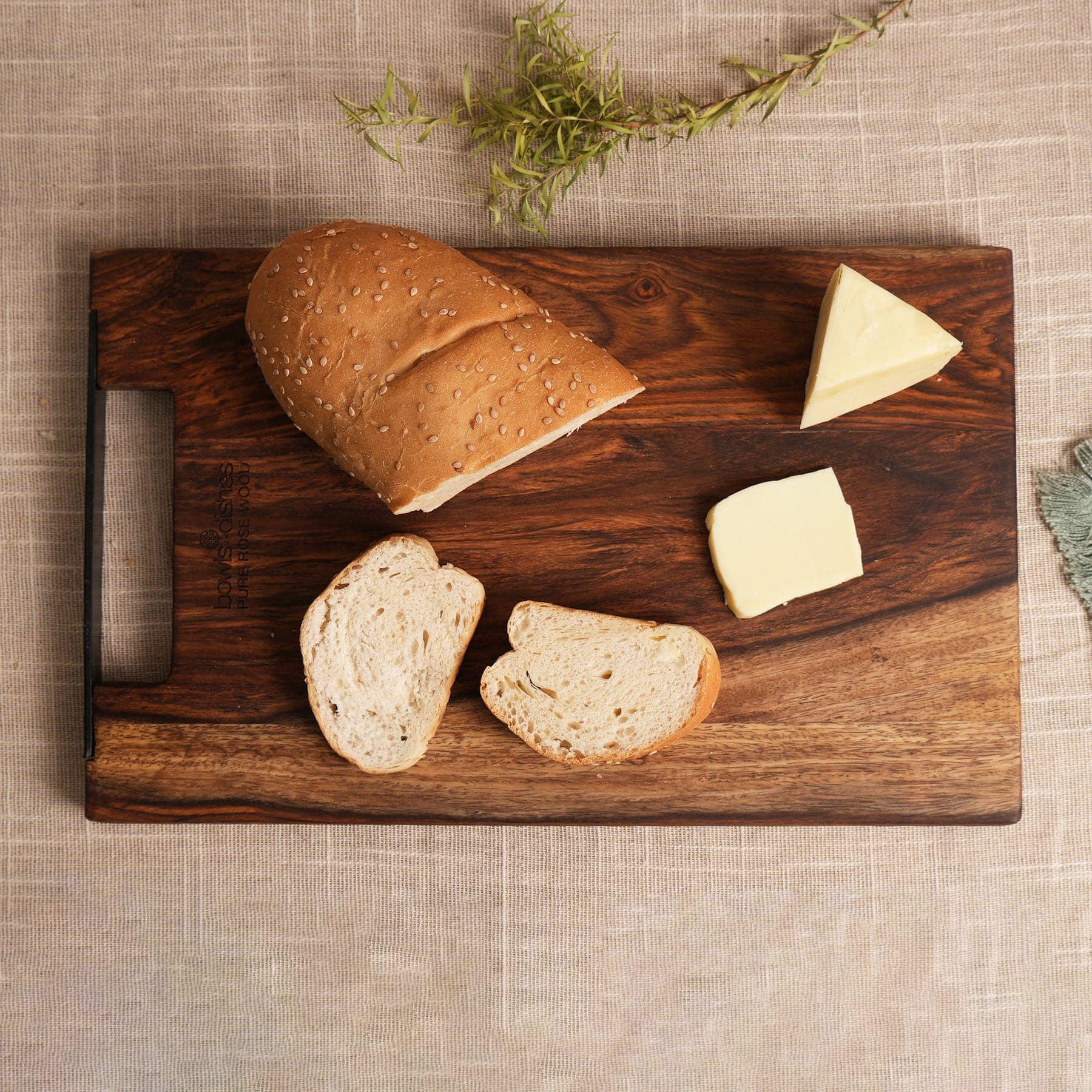 Warm kitchen counter styled with handcrafted wooden boards and serveware